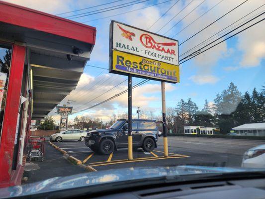 Signage. Notice the illegally parked car...