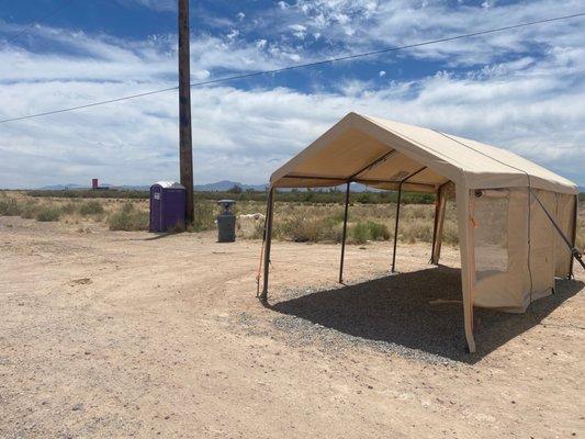 Shade, hand wash station, and toilet. On a Sunday afternoon