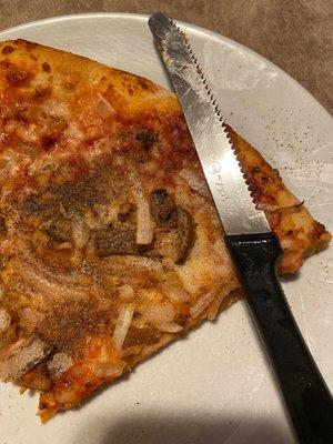 This is the slice of mushroom I got on every slice of pizza on my mushroom pizza... so very disappointing