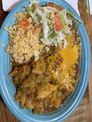 Chile relleno plate with rice and papas covered with green chile