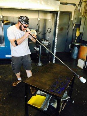 Glen demonstrating glassblowing. It's so much harder -- and even more fun -- than it looks.