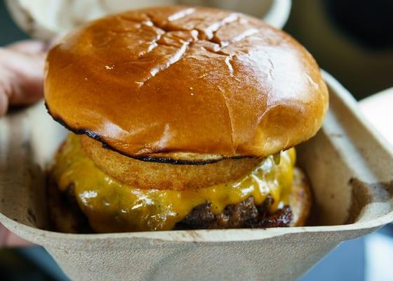 Bacon Burger in the take-out container. Nice to see them using a container that is probably more environmentally-friendly than styrofoam.