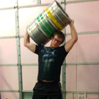 Keg Lift, strongman-style strength training.