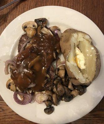 Hamburger steak and baked potato.