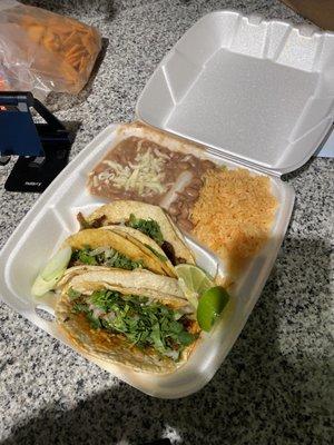 Taco combo: chorizo, al pastor, and asada traditional style with rice and beans