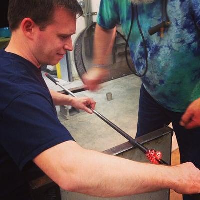 Sean adding a swirled pattern to his ornament.