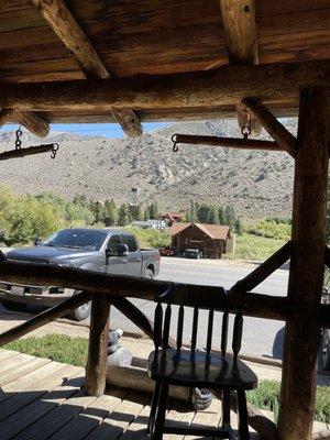 we sat and watched football , ate . The little porch where I sat &took a picture of the old timers cabin across the street.