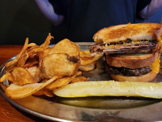 Smoked brisket and cheese toasted sandwich with pub chips