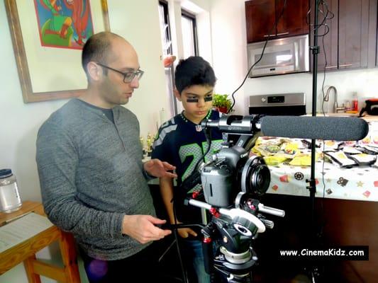 Children learn how to use professional filmmaking equipments