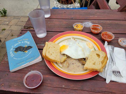 Ano nuevo. Gravy over potatoes with eggs and sourdough toast. Salsa and jelly upon request.