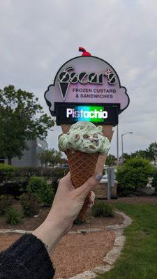 Pistachio frozen custard on their waffle cone