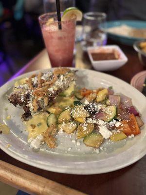 Grilled avocado with brisket and veggies.