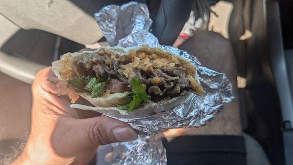 Not so huge burrito, with refried beans, Spanish rice, carne asada, cilantro, and pico.