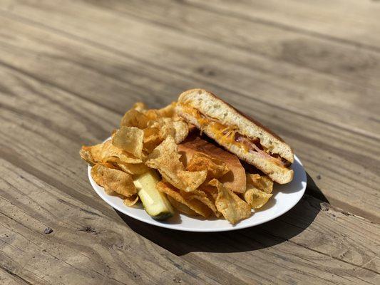 Ham, Cheddar and Bacon toasted panini!  (hot sandwich) Comes with a pickle and a side of chips.  [gluten-free bun available!]