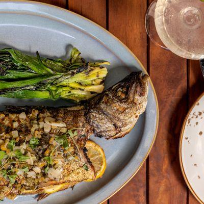 BRANZINO | herb marinated whole branzino, grilled baby leek, fennel, Meyer lemon, vermouth butter sauce, micro parsley