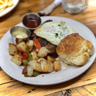 Griddled Meatloaf with house potatoes & a homemade biscuit.