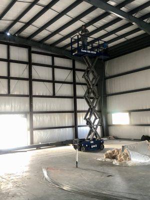 Here's Sam on a lift installing the hangers for a commercial installation. I was very uncomfortable on that lift.