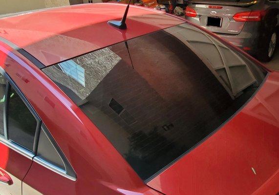 Real window and small drivers side rear window.