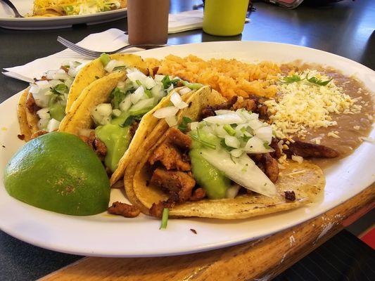 Adobada taco platter with rice and beans