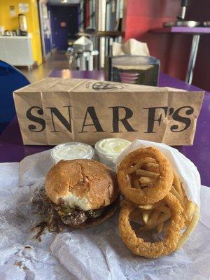 Spicy A-1 burger with fries and onion rings.