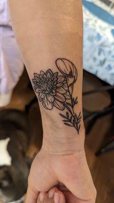 Matching tattoos with niece calla Lily and dahlia. By Nacho