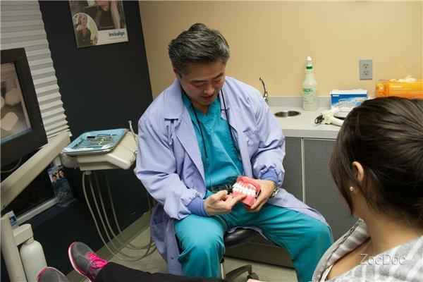 Dr. Kim educating on the importance of clean teeth.