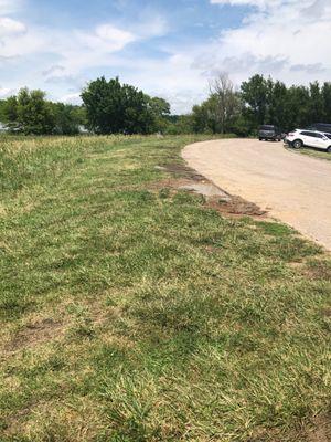 This big mud puddle is parking.