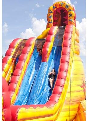 Kids in action on the lava twist from premiere inflatables!