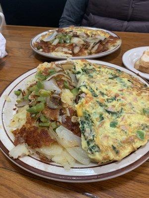 Omelette and potatoes with onions and peppers.