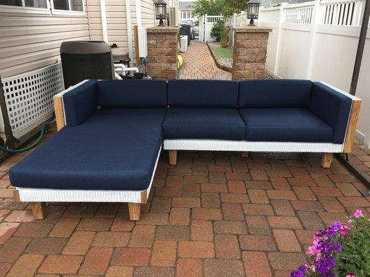 Catalina grouping by Lloyd Flanders featuring genuine steak accents and Lloyd Loom wicker in white.