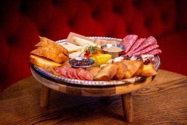 Meat and Cheese Board Seasonal cured meats & cheeses, fig jam, cognac mustard, giardinara, toasted brioche bun