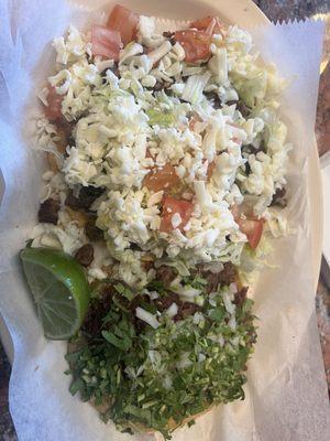 Carne asada tostada on top  Barbacoa taco on bottom- must have it!