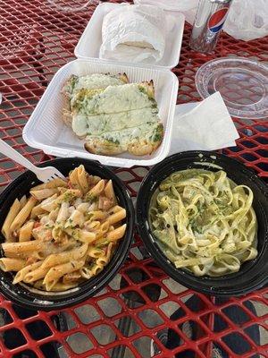 Cajun chicken pasta, chicken pesto pasta, and pesto bread.