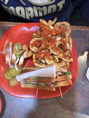 Club sandwich with curly fries