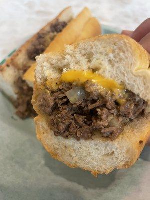 Inside the steak & cheese.