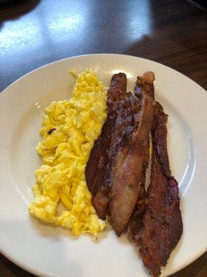 Scrambled eggs and side of bacon.