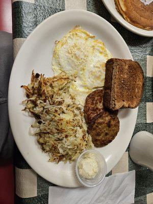 Egg over medium, hash browns, wheat toast