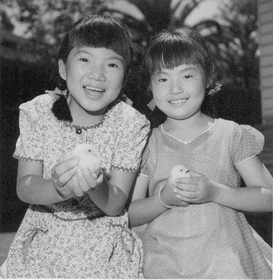 http://bit.ly/1v86hGG  July 14, 1945 - Rev. Osuga and family return from internment at Heart Mountain. His 2 daughters shown.