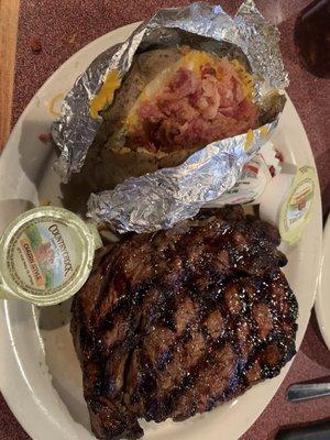 Ribeye with loaded baked potato