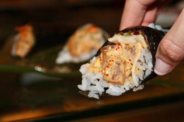 The Big Eye Tuna Hand Roll is made with crisp onion, sushi rice and yuzu kosho.