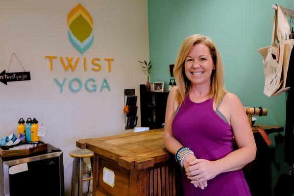 Jennifer Pahl, Owner of Twist Yoga and Twist Your Workplace, at the front desk'