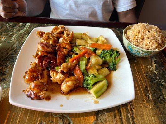 Hibachi shrimp chicken and lobster with fried rice.