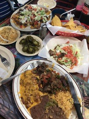 Nacho plate, and the number 7, enchilada, beef fajitas, and a tostada!