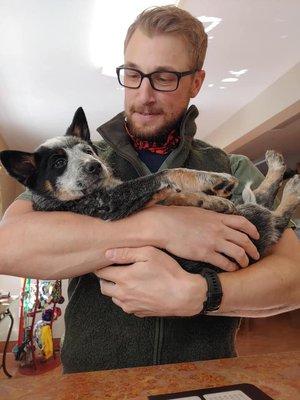 One of our talented certified veterinary technicians loving on a patient after the exam