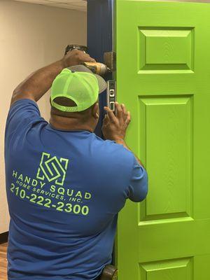 Steve installing a door at the office.