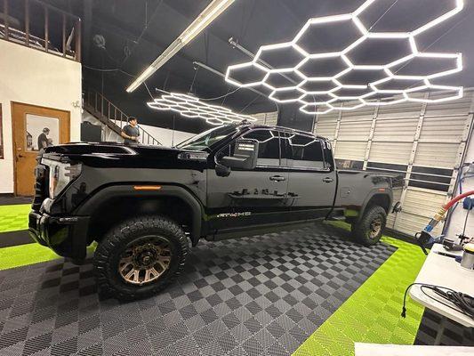 Black crew cab long bed, looking wet