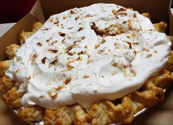 Coconut cream pie with whipped topping.