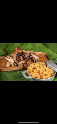 Slow roasted pork shoulder with yellow rice and pigeon peas