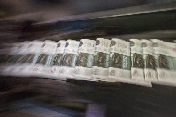 A Sunday edition of The Virginian-Pilot comes off the presses in September 2014 at the Greenwich Road printing plant in Virginia Beach.