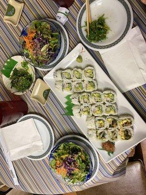 California Roll, kimchi avocado roll, house salads, and seaweed salad